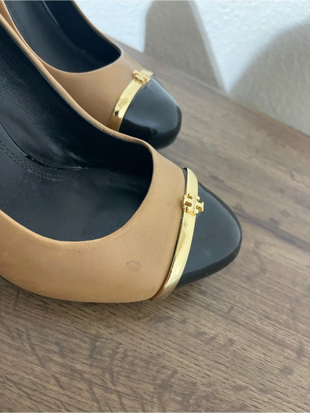 Tory Burch Two-Tone Tan and Black Cap-Toe Pumps with Gold Accent